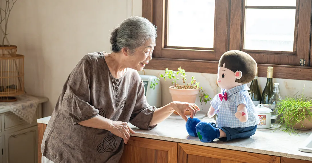 A senior individual interacting with an AI companion doll A senior individual interacting with an AI companion doll