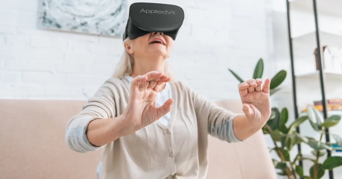 A woman using an AppliedVR headset at home A woman using an AppliedVR headset at home