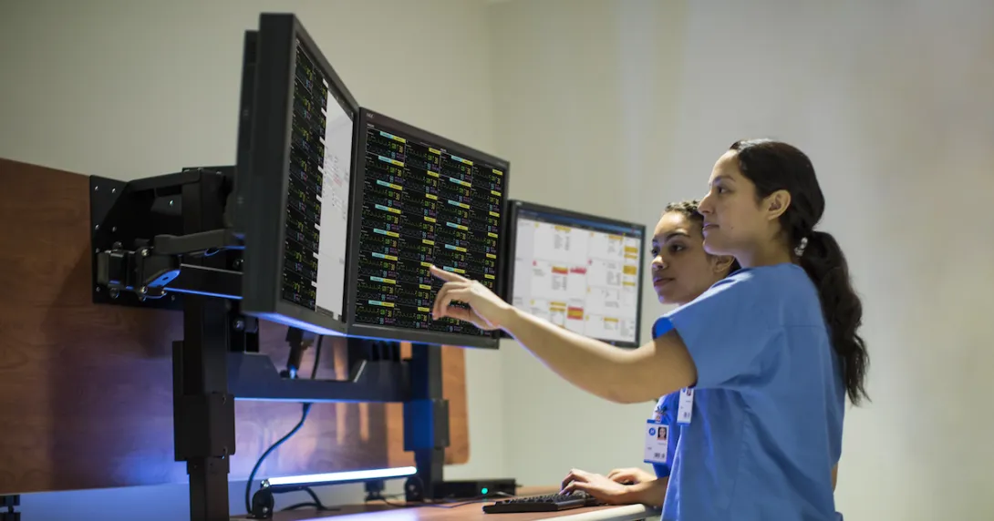 Clinicians using Philips' patient monitoring portal. Clinicians using Philips' patient monitoring portal.