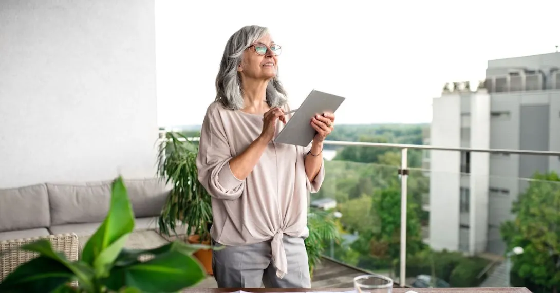 An older woman using a tablet An older woman using a tablet