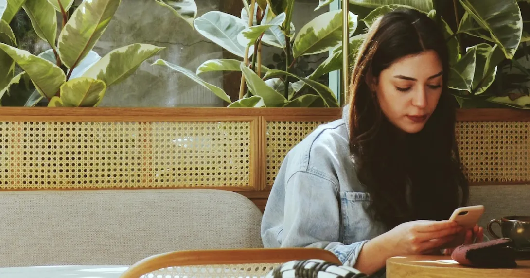 A young person using their smartphone A young person using their smartphone