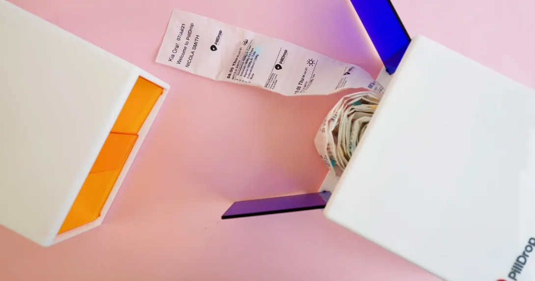 PillDrop's dispenser with a roll of sorted and individually labelled sachets of medication