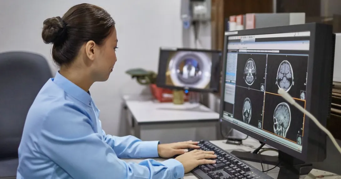 A radiologist looking at brain scans A radiologist looking at brain scans