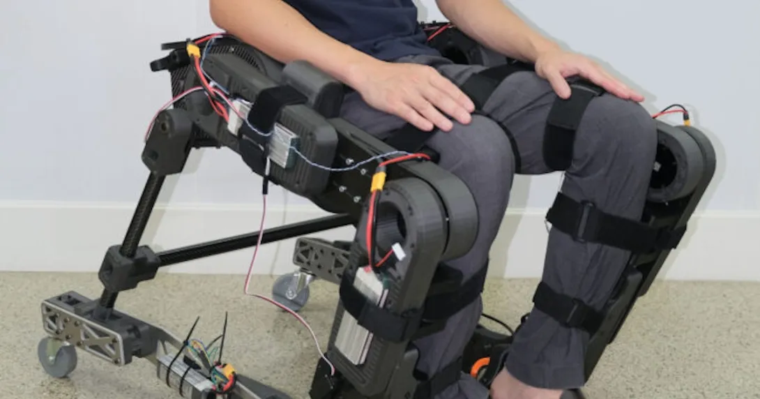 A person wearing the prototype hybrid wheelchair and exoskeleton A person wearing the prototype hybrid wheelchair and exoskeleton