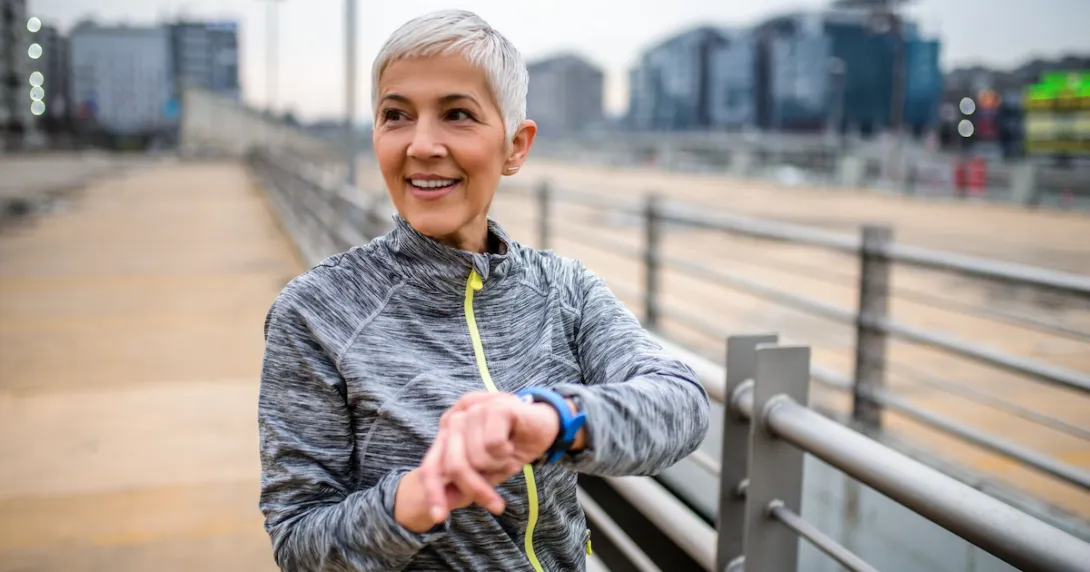 A person using a smartwatch while exercising. A person using a smartwatch while exercising.