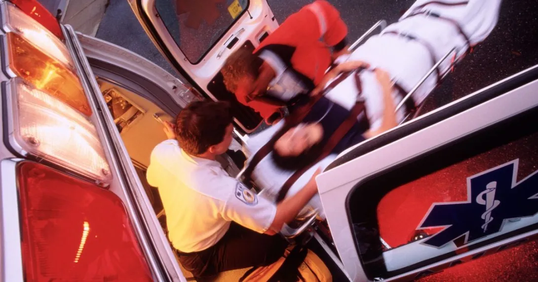 Overhead picture of emergency medical services loading a patient into an ambulance Overhead picture of emergency medical services loading a patient into an ambulance