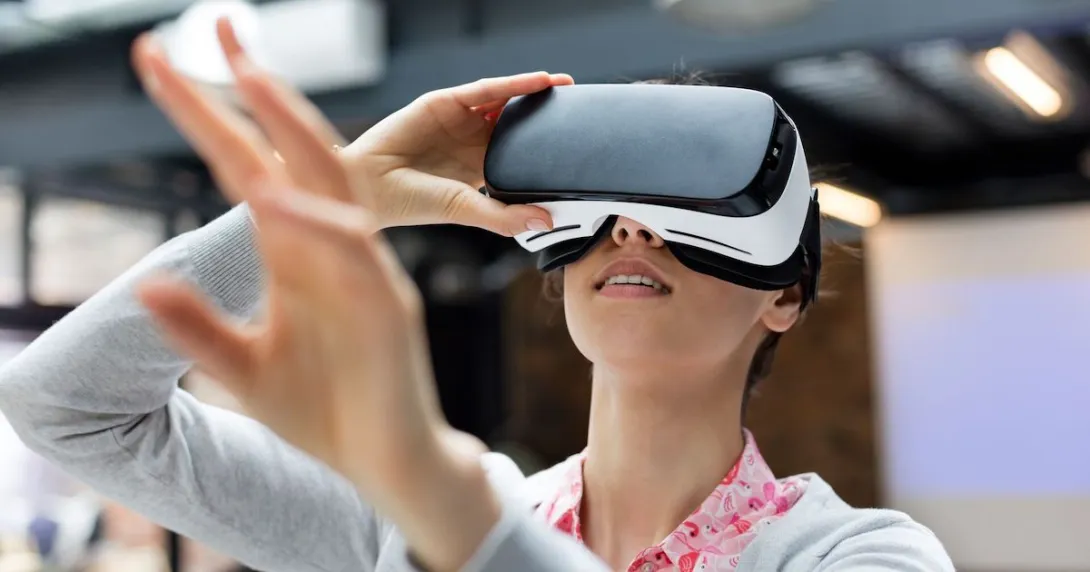 Person wearing a virtual reality headset Person wearing a virtual reality headset