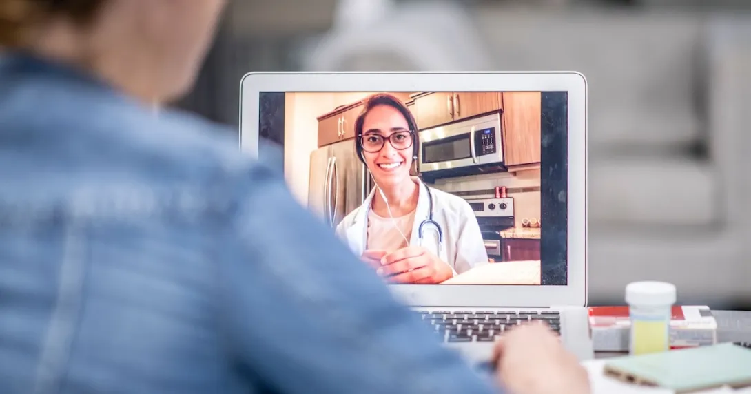 A patient in a virtual consultation with a doctor A patient in a virtual consultation with a doctor