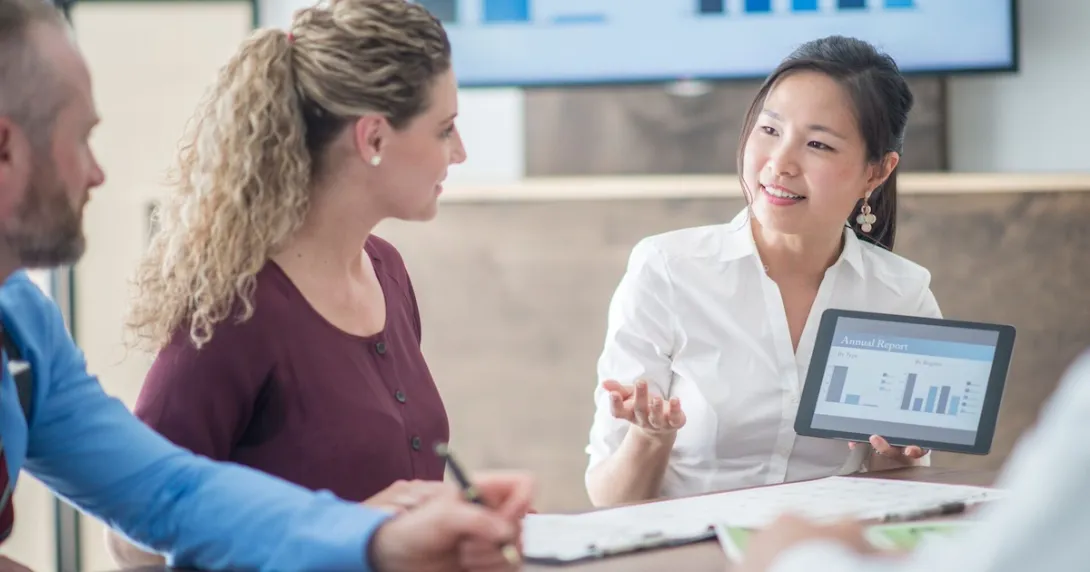 People sitting around a table talking to each other
