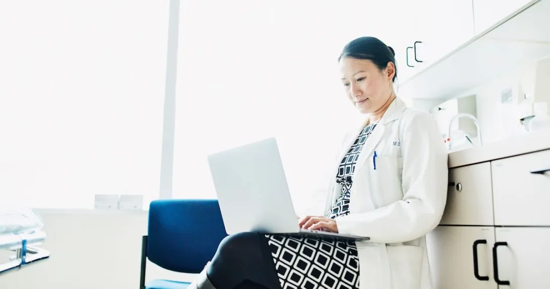 A doctor working on their laptop A doctor working on their laptop