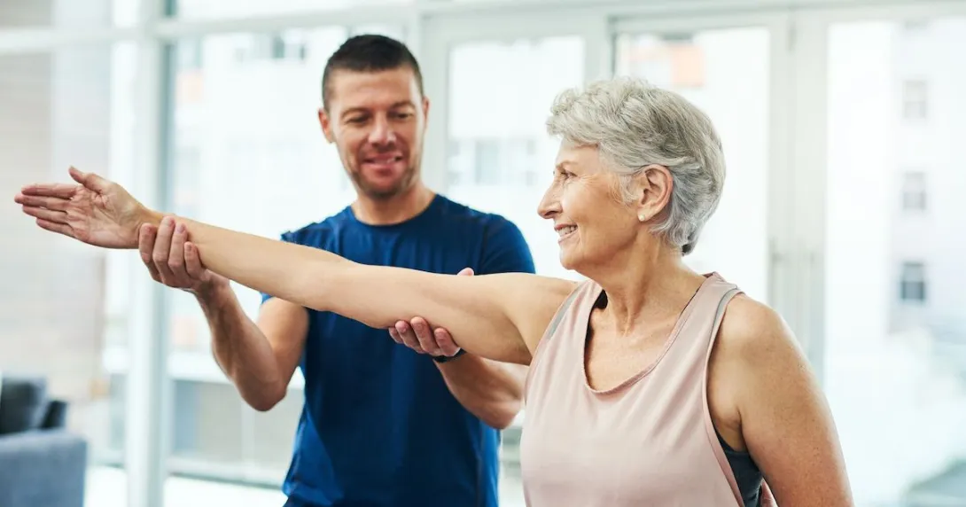 A physiotherapist working with a senior patient