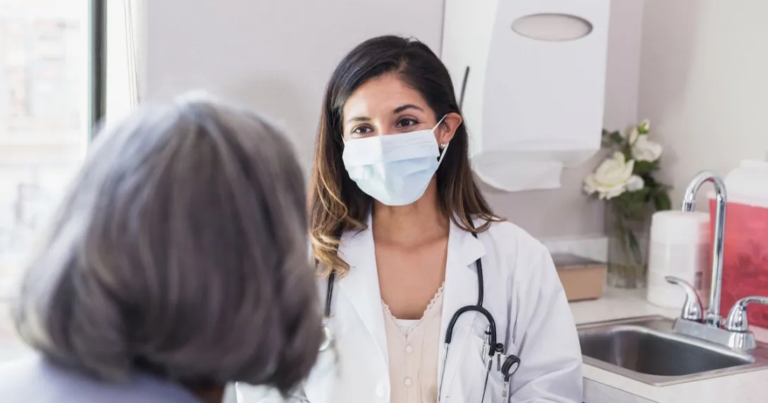 A doctor consulting with an elderly patient A doctor consulting with an elderly patient